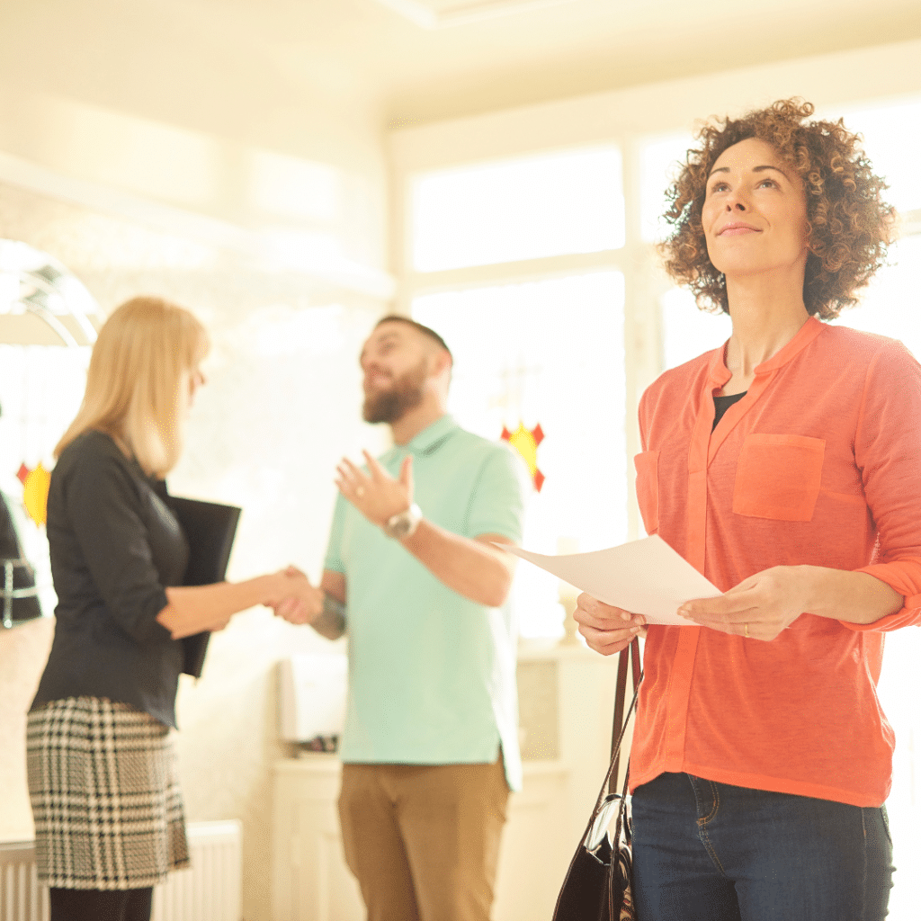 Realtor and Homeowners shaking hands in agreement