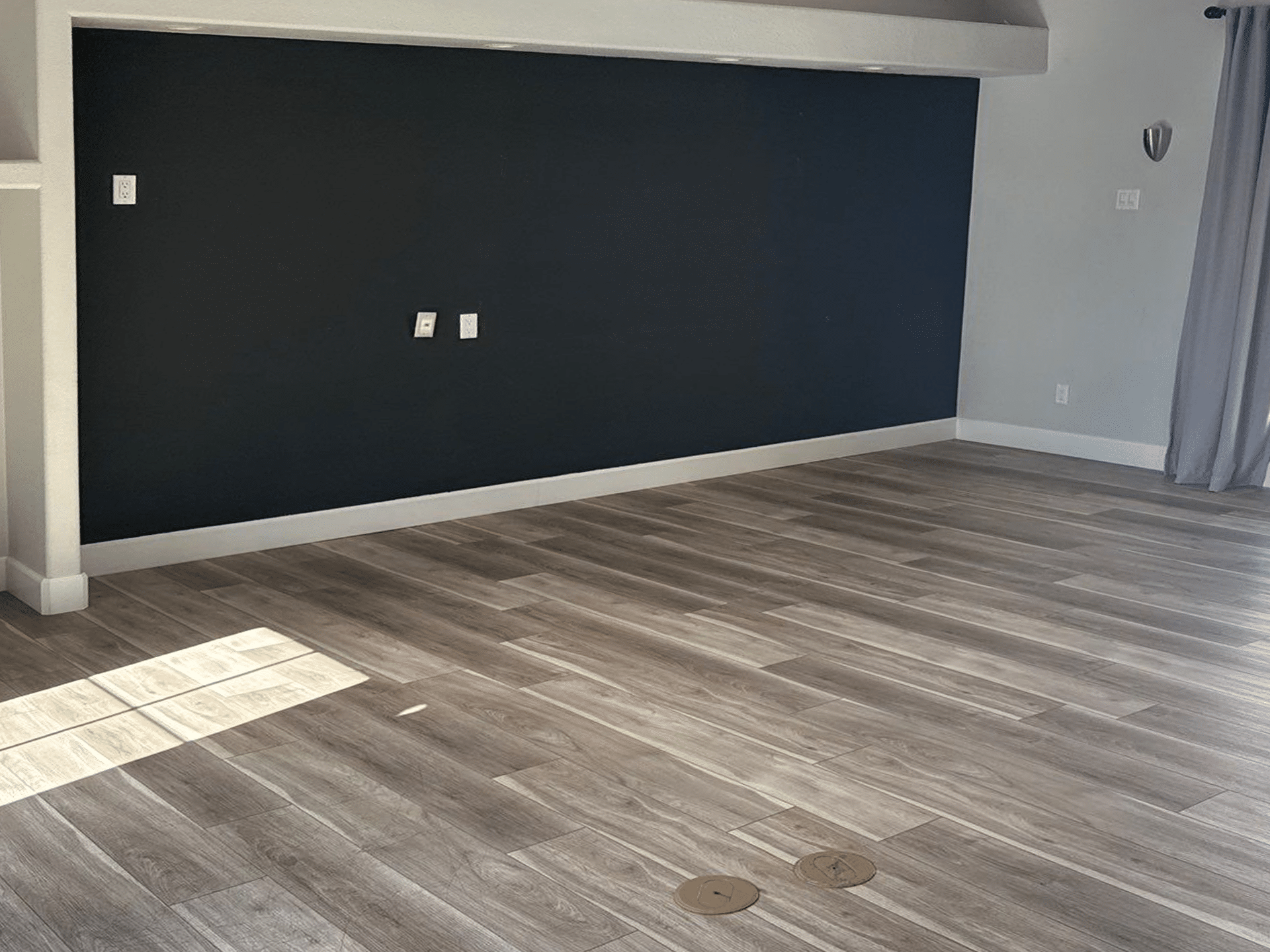 Before home staging of an empty Phoenix living room prior to furnishing and styling